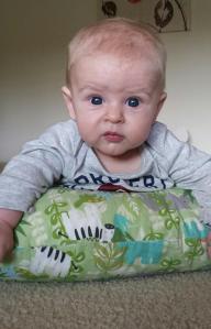 The Boppy Pillow helps him sit up more while on his belly. 