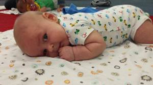 At gym class each week, we practice getting used to  tummy time. 