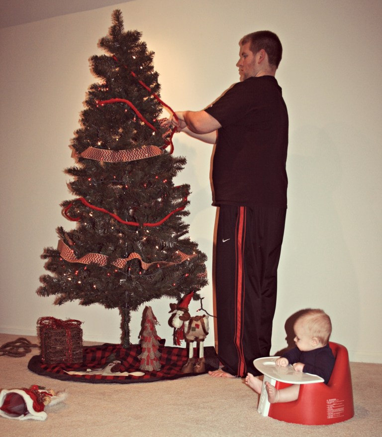 Brent loves to decorate the tree.